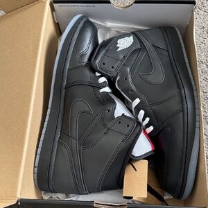 Jordan Black and White High-Top Sneakers